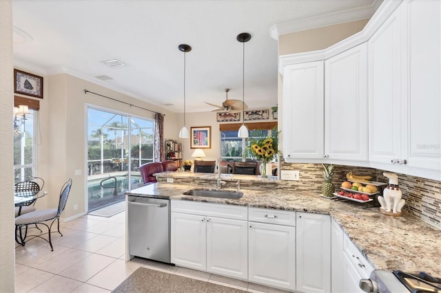 4743 Spinnaker Dr, Bradenton, FL 34208 - kitchen with dishwasher, decorative backsplash, a peninsula, light tile patterned flooring, and a ceiling fan