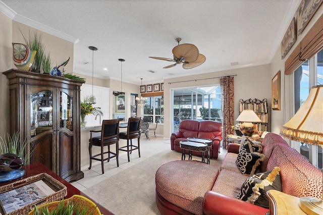 4743 Spinnaker Dr, Bradenton, FL 34208 - living area with plenty of natural light, ceiling fan, light tile patterned flooring, and ornamental molding