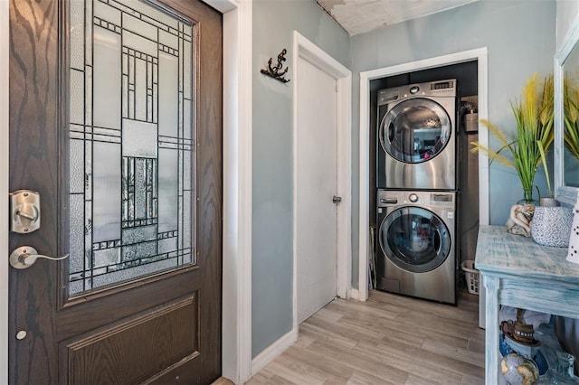1403 Tallahassee Dr, Tarpon Springs, FL 34689 - laundry room featuring estacked washer and dryer and wood finished floors