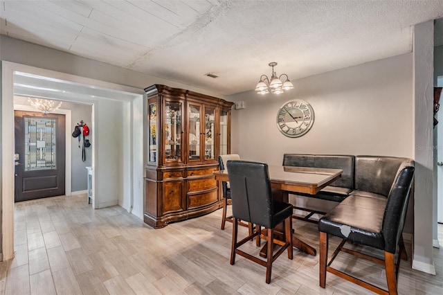 1403 Tallahassee Dr, Tarpon Springs, FL 34689 - dining area with a chandelier and light wood-type flooring