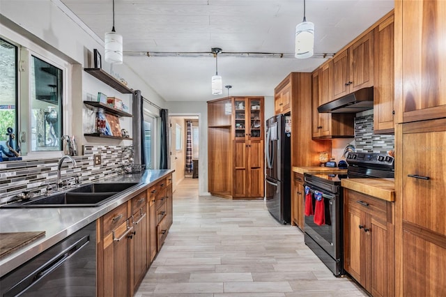 1403 Tallahassee Dr, Tarpon Springs, FL 34689 - kitchen featuring electric range oven, under cabinet range hood, freestanding refrigerator, dishwashing machine, and open shelves