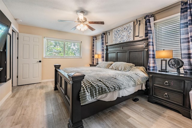 1403 Tallahassee Dr, Tarpon Springs, FL 34689 - bedroom with light wood-type flooring and ceiling fan