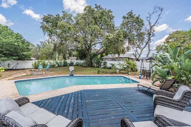 1403 Tallahassee Dr, Tarpon Springs, FL 34689 - view of pool with a fenced backyard and a wooden deck