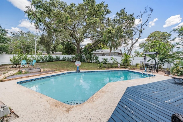 1403 Tallahassee Dr, Tarpon Springs, FL 34689 - view of swimming pool featuring a fenced backyard and a patio area