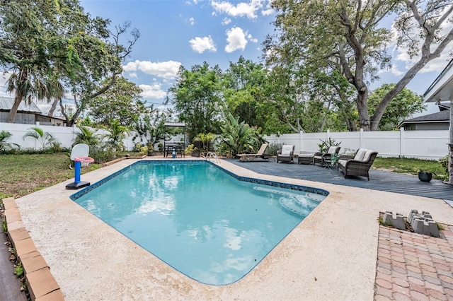 1403 Tallahassee Dr, Tarpon Springs, FL 34689 - view of pool featuring a fenced backyard, an outdoor hangout area, a wooden deck, and a patio area
