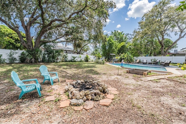 1403 Tallahassee Dr, Tarpon Springs, FL 34689 - fenced backyard with a fire pit
