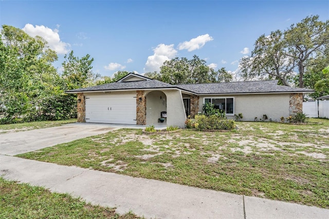 1403 Tallahassee Dr, Tarpon Springs, FL 34689 - ranch-style home featuring stone siding, driveway, stucco siding, and a garage