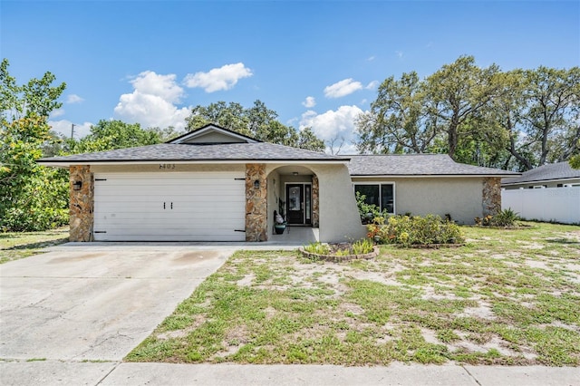 1403 Tallahassee Dr, Tarpon Springs, FL 34689 - single story home with a garage, driveway, stucco siding, a shingled roof, and stone siding