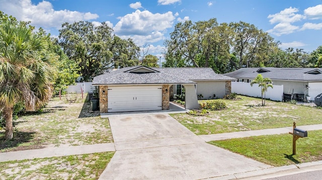 1403 Tallahassee Dr, Tarpon Springs, FL 34689 - view of front of property with driveway and an attached garage
