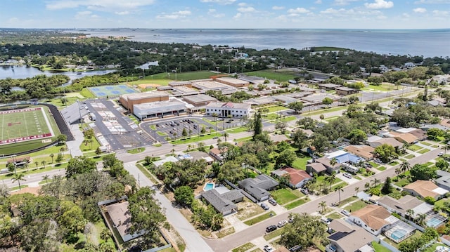 1403 Tallahassee Dr, Tarpon Springs, FL 34689 - aerial perspective of suburban area featuring a large body of water