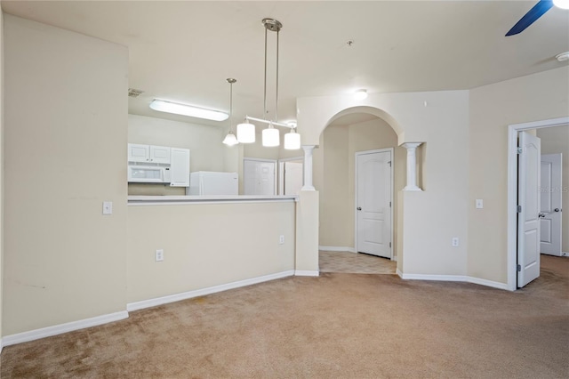 1640 Villa Capri Cir Unit 206, Odessa, FL 33556 - spare room with light colored carpet, ceiling fan, arched walkways, and a pendent fire sprinkler