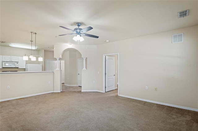 1640 Villa Capri Cir Unit 206, Odessa, FL 33556 - unfurnished living room featuring a ceiling fan and light colored carpet