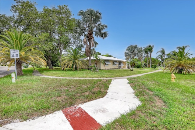 1340 NE Mariposa Dr NE, Palm Bay, FL 32905 - view of front facade featuring a front lawn