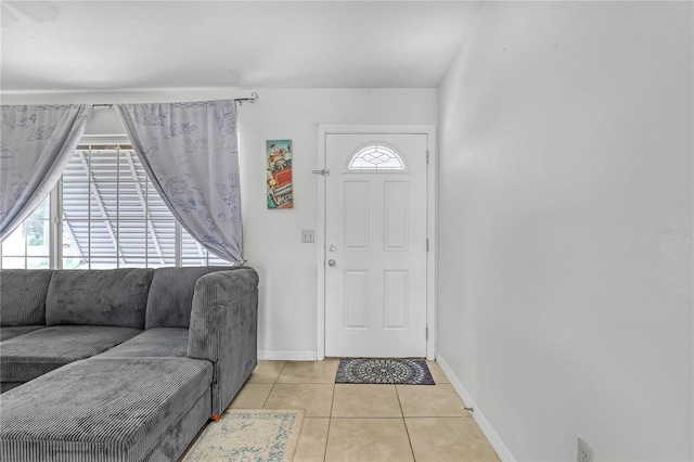 1340 NE Mariposa Dr NE, Palm Bay, FL 32905 - foyer entrance featuring light tile patterned floors and baseboards
