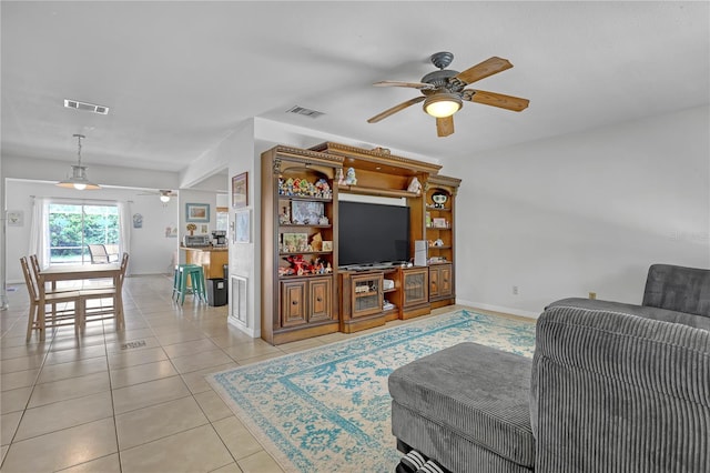 1340 NE Mariposa Dr NE, Palm Bay, FL 32905 - living area with a ceiling fan and light tile patterned flooring