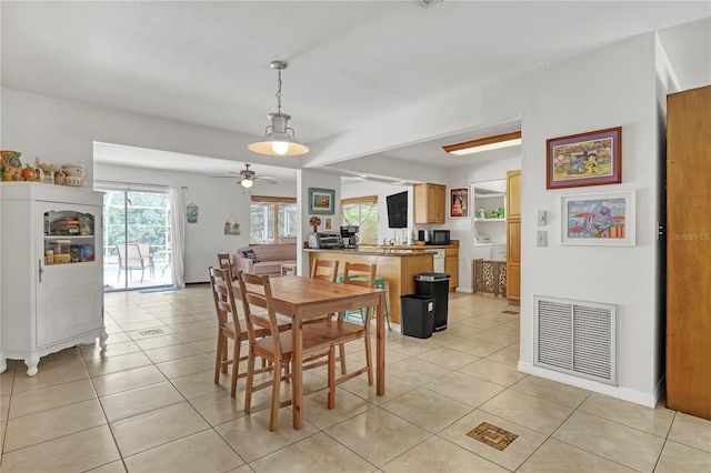 1340 NE Mariposa Dr NE, Palm Bay, FL 32905 - dining space with ceiling fan and light tile patterned flooring