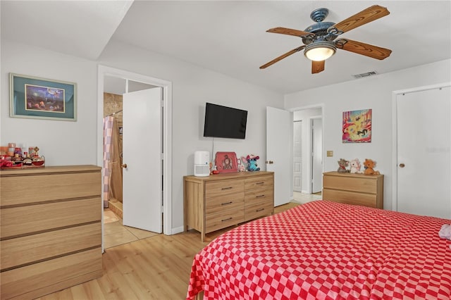 1340 NE Mariposa Dr NE, Palm Bay, FL 32905 - bedroom with light wood-style flooring and a ceiling fan