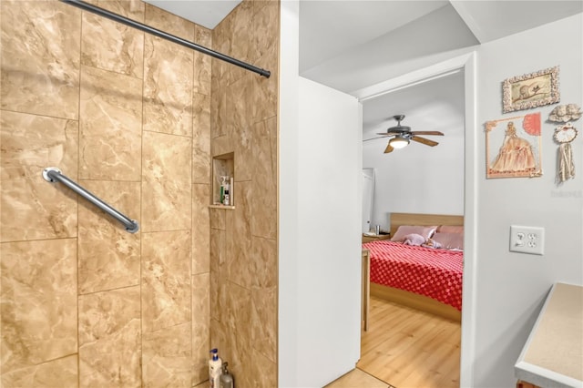 1340 NE Mariposa Dr NE, Palm Bay, FL 32905 - full bath featuring a tile shower, ceiling fan, and wood finished floors