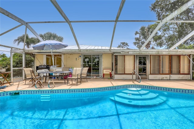 1340 NE Mariposa Dr NE, Palm Bay, FL 32905 - swimming pool featuring a lanai, a patio area, and outdoor dining space