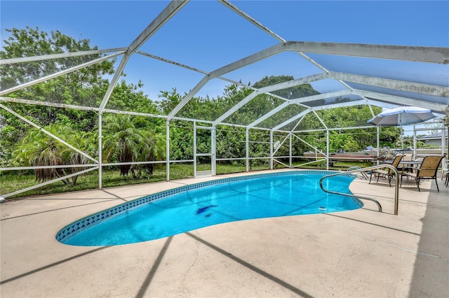 1340 NE Mariposa Dr NE, Palm Bay, FL 32905 - swimming pool with a patio and glass enclosure