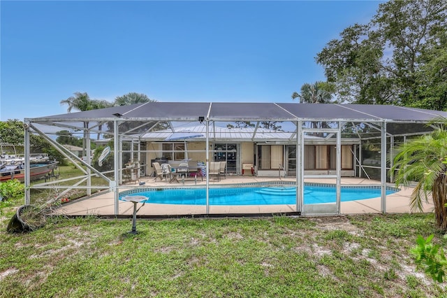 1340 NE Mariposa Dr NE, Palm Bay, FL 32905 - swimming pool with a lanai and a patio
