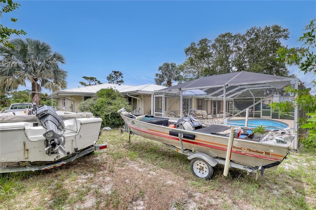 1340 NE Mariposa Dr NE, Palm Bay, FL 32905 - back of property featuring an outdoor pool and a lanai