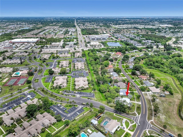 1340 NE Mariposa Dr NE, Palm Bay, FL 32905 - aerial view of property's location featuring a nearby body of water and nearby suburban area