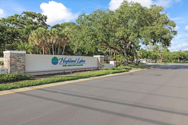 2850 Doone Cir, Palm Harbor, FL 34684 - community / neighborhood sign featuring view of scattered trees