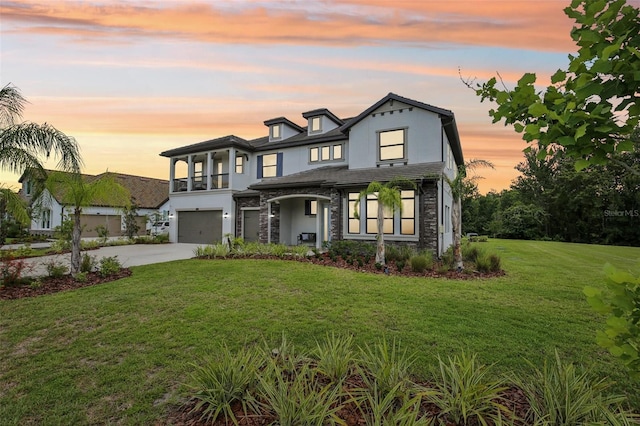 2903 Cordoba Ranch Blvd, Lutz, FL 33559 - view of front of house featuring stone siding, a garage, driveway, stucco siding, and a yard