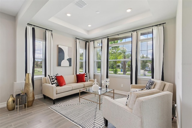 2903 Cordoba Ranch Blvd, Lutz, FL 33559 - living area with plenty of natural light, a tray ceiling, light wood-style flooring, and recessed lighting
