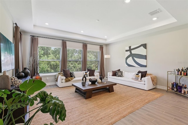 2903 Cordoba Ranch Blvd, Lutz, FL 33559 - living room with a tray ceiling, light wood-type flooring, and recessed lighting