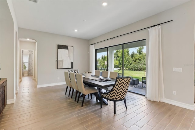 2903 Cordoba Ranch Blvd, Lutz, FL 33559 - dining area featuring healthy amount of natural light, arched walkways, light wood-style flooring, and recessed lighting
