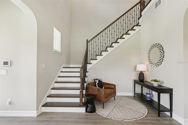 2903 Cordoba Ranch Blvd, Lutz, FL 33559 - staircase featuring arched walkways and wood finish floors