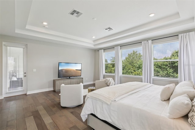 2903 Cordoba Ranch Blvd, Lutz, FL 33559 - bedroom with a tray ceiling, dark wood-type flooring, recessed lighting, and access to exterior