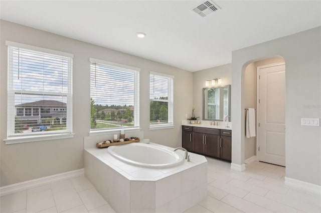 2903 Cordoba Ranch Blvd, Lutz, FL 33559 - bathroom featuring vanity, a bath, and tile patterned flooring