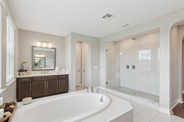 2903 Cordoba Ranch Blvd, Lutz, FL 33559 - full bathroom featuring a stall shower, vanity, a garden tub, and healthy amount of natural light