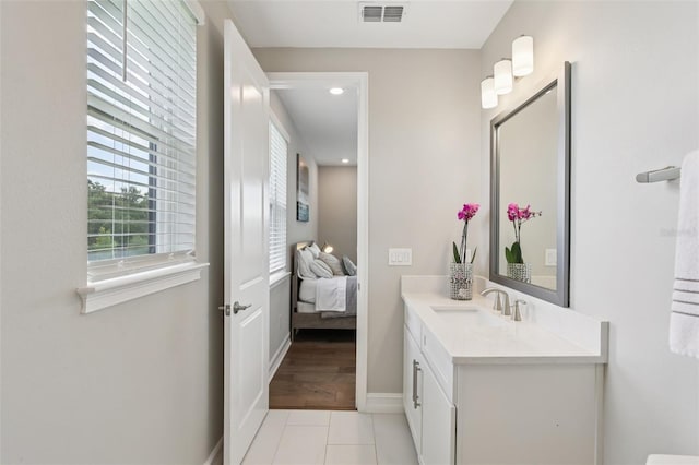 2903 Cordoba Ranch Blvd, Lutz, FL 33559 - bathroom with vanity, tile patterned floors, connected bathroom, and recessed lighting