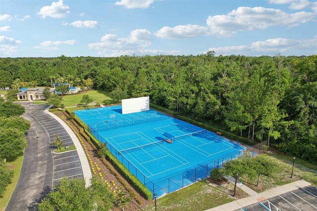 2903 Cordoba Ranch Blvd, Lutz, FL 33559 - view of tennis court featuring a forest view