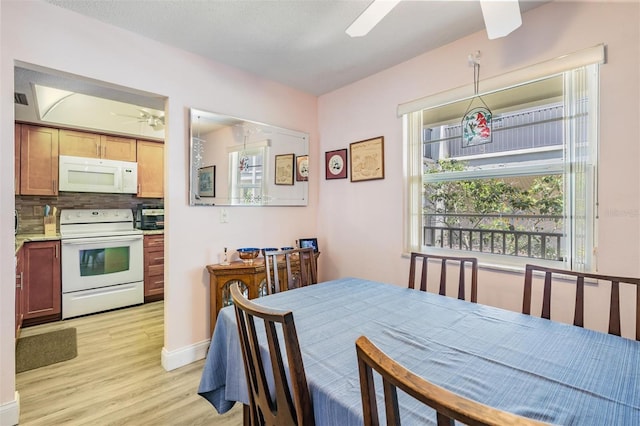 2700 Bayshore Blvd Unit 6210, Dunedin, FL 34698 - dining area featuring a ceiling fan and light wood finished floors