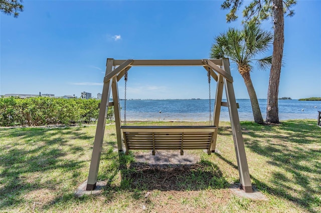2700 Bayshore Blvd Unit 6210, Dunedin, FL 34698 - surrounding community with a water view and a lawn