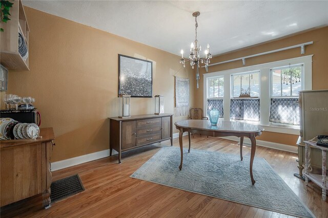917 W Idlewild Ave, Tampa, FL 33604 - office space with a chandelier and light wood-type flooring