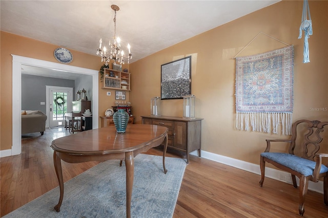 917 W Idlewild Ave, Tampa, FL 33604 - dining space with wood finished floors and a chandelier