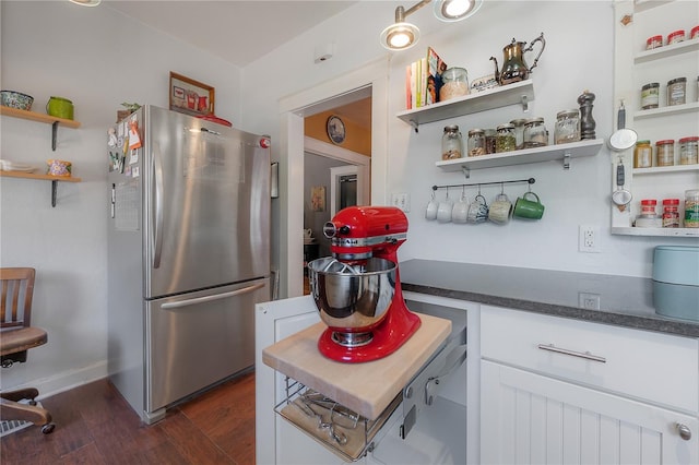 917 W Idlewild Ave, Tampa, FL 33604 - kitchen featuring freestanding refrigerator, open shelves, dark wood-style floors, white cabinetry, and dark countertops