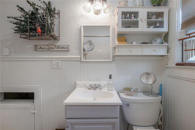 917 W Idlewild Ave, Tampa, FL 33604 - bathroom featuring a wainscoted wall, vanity, and a chandelier