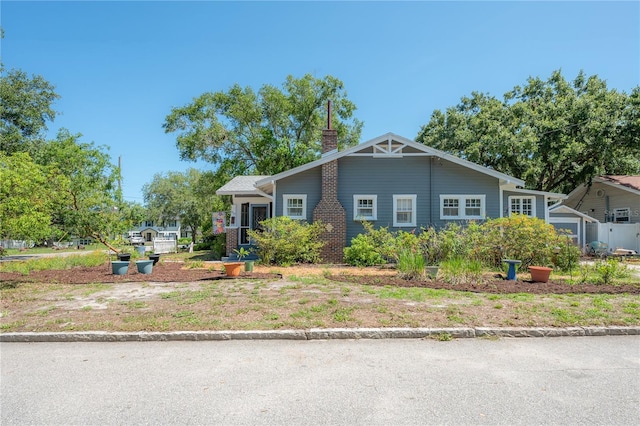 917 W Idlewild Ave, Tampa, FL 33604 - view of front of house with a chimney and brick siding