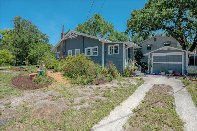 917 W Idlewild Ave, Tampa, FL 33604 - view of front facade featuring an outdoor structure, a chimney, and entry steps