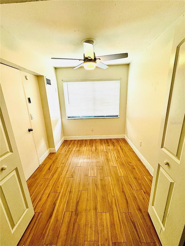 4611 W N B St Unit 228, Tampa, FL 33609 - unfurnished room with wood finished floors, a ceiling fan, and a textured ceiling