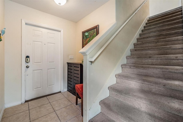 15420 Quail Woods Pl, Ruskin, FL 33573 - entrance foyer featuring stairs and light tile patterned floors