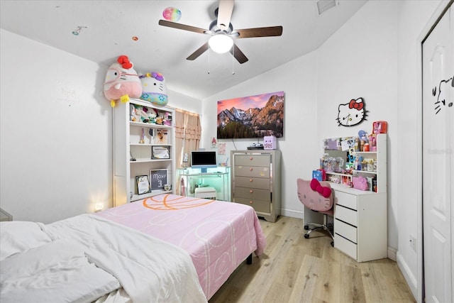 9831 Edmonton Dr, Land O Lakes, FL 34638 - bedroom with vaulted ceiling, wood finished floors, and ceiling fan