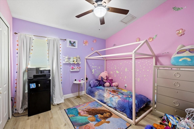 9831 Edmonton Dr, Land O Lakes, FL 34638 - bedroom featuring wood finished floors and ceiling fan